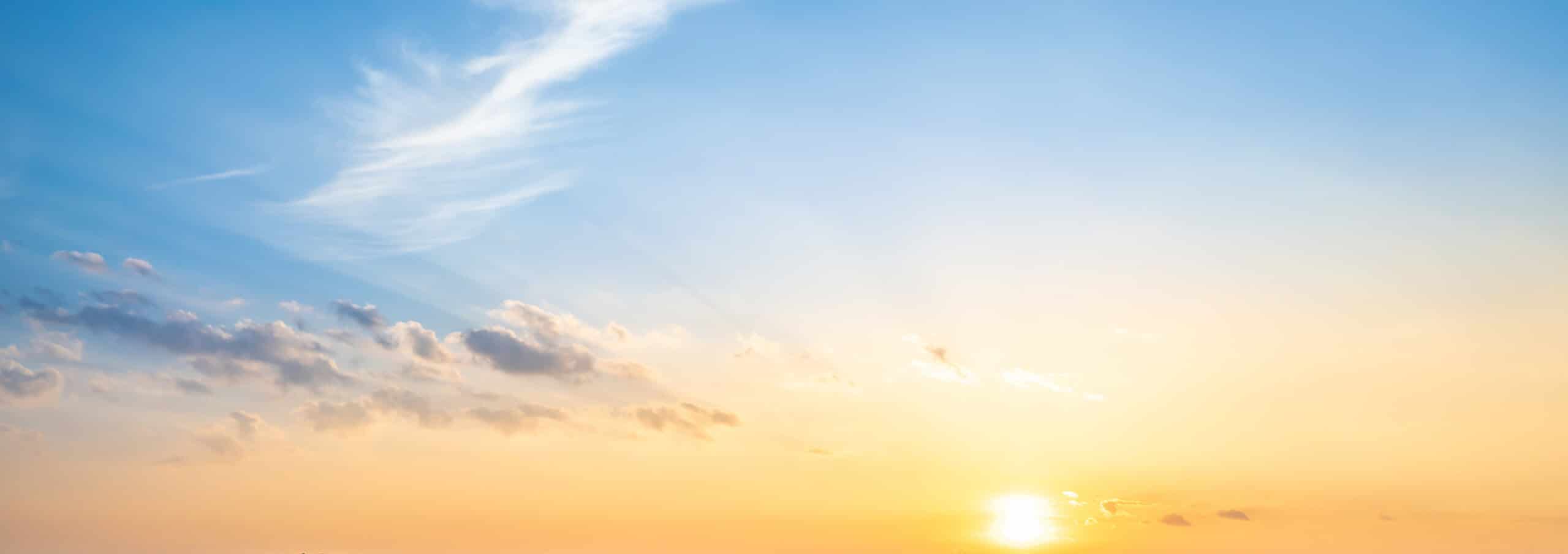 Blue sky and orange sunset panorama